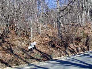Route sign for Mt. Genjirodake posted at forestry road.